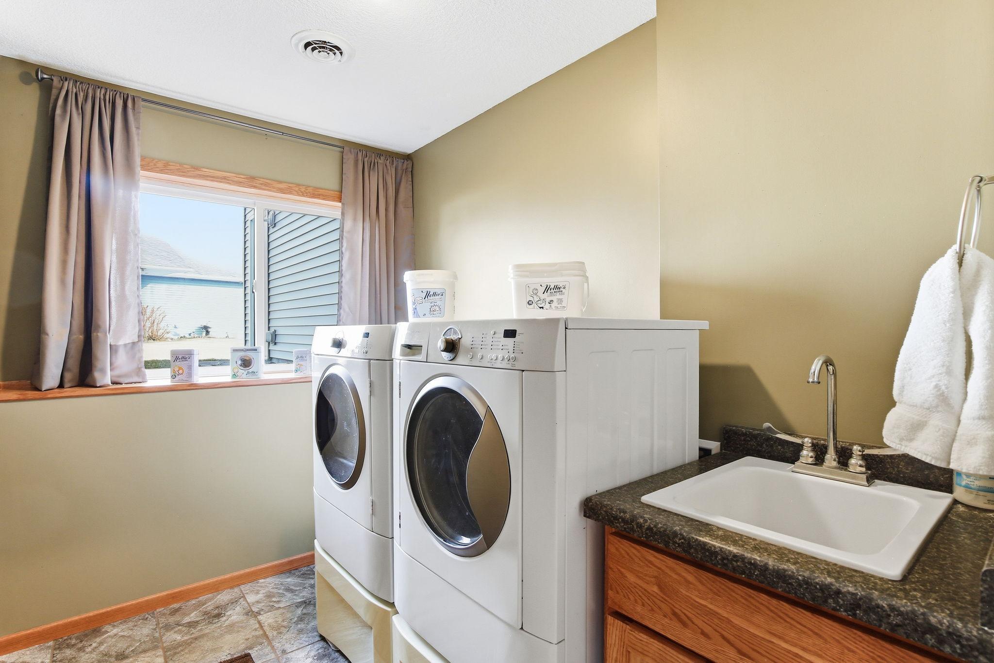 Good Sized Laundry Room with a large window!