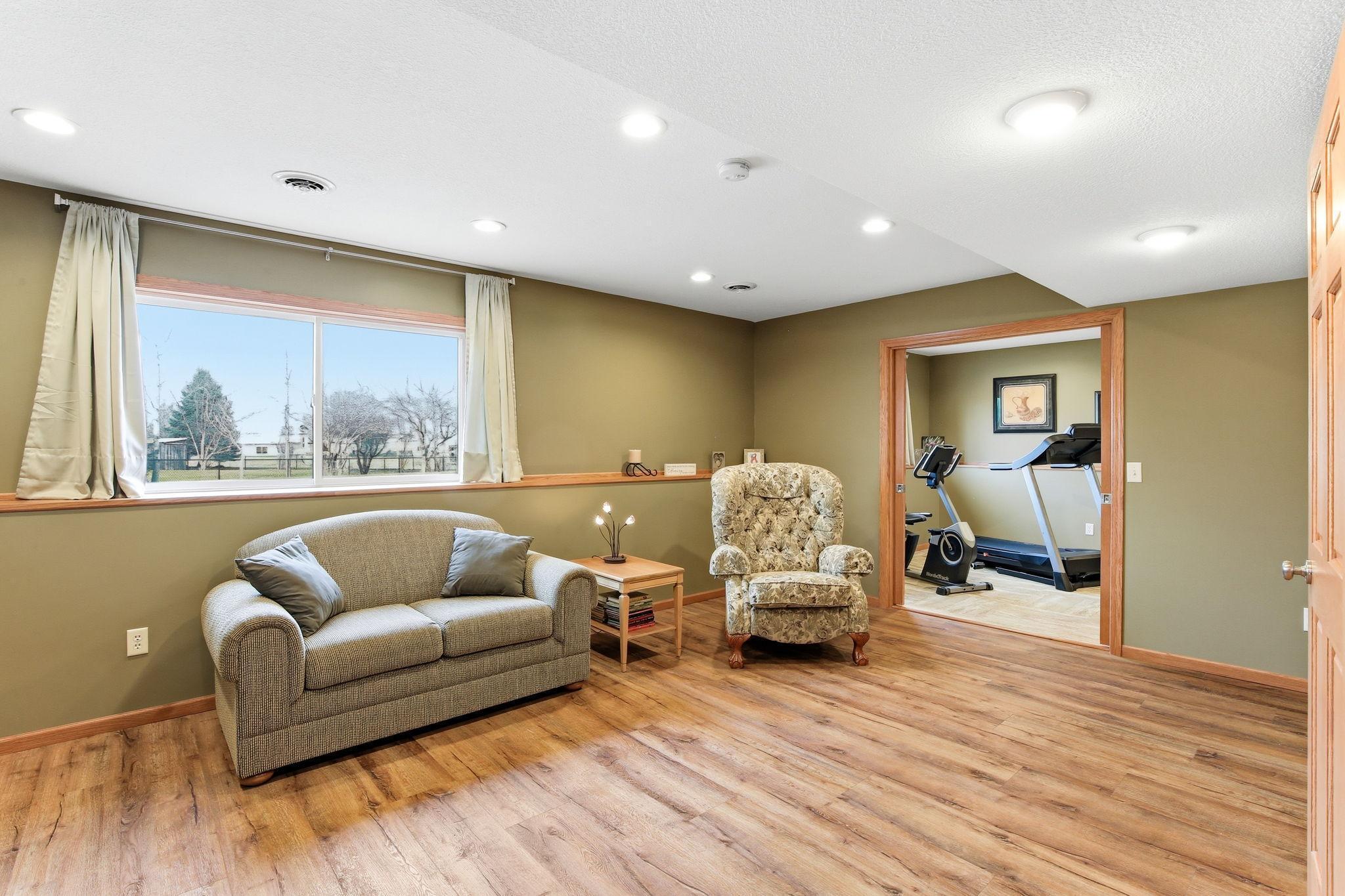 Lower level Family Room has nice LVP flooring and recessed lights.