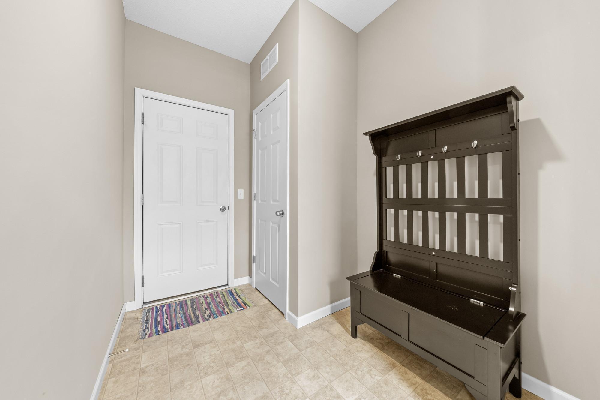 Spacious mud room area as you enter from the garage