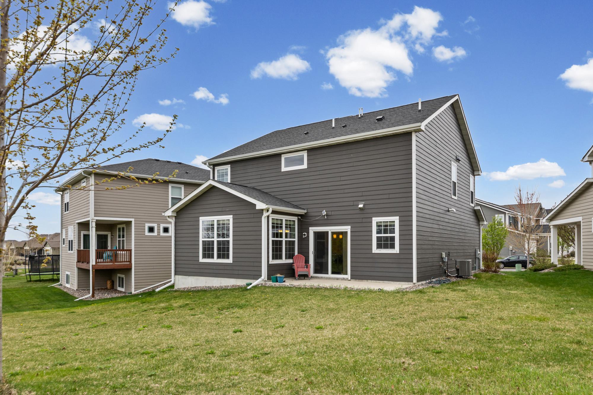 The back yard has a very nice patio and plenty of room to play!