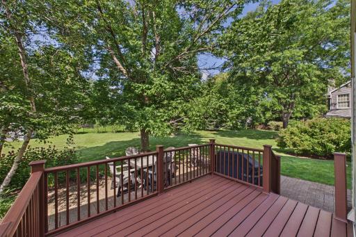 The zero-maintenance deck right off the informal dining room has incredible space for hosting or just relaxing after a long day.