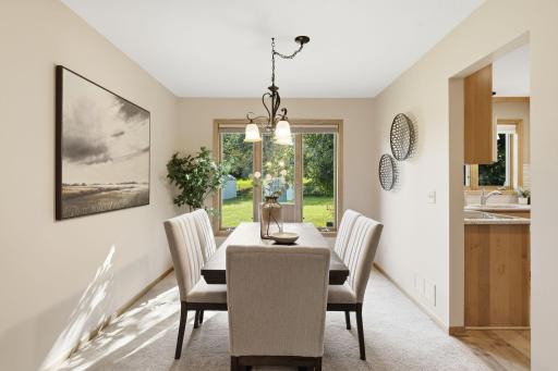 Formal dining room right off the kitchen offers a place for large gatherings.