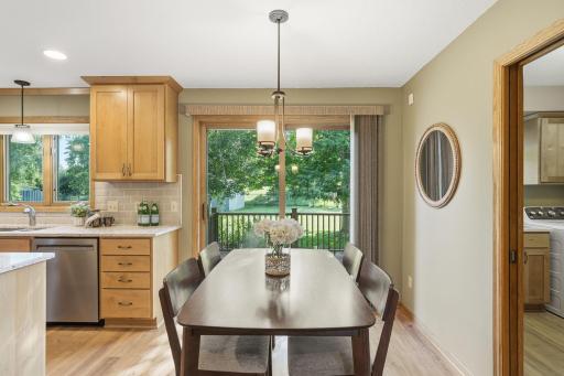 The informal dining space has direct access to the patio and backyard.