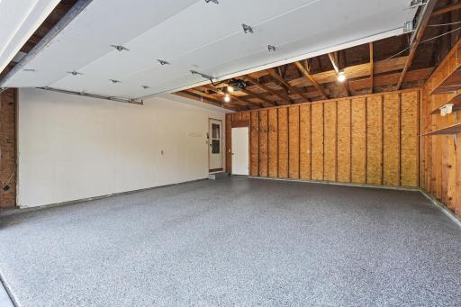 The extra large two stall garage has an epoxy flooring already installed. You will feel that extra space on each side of the garage door opening.