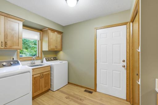 Laundry room and mudroom are right off the garage door entrance.