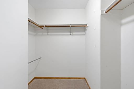 Primary bedroom walk-in closet