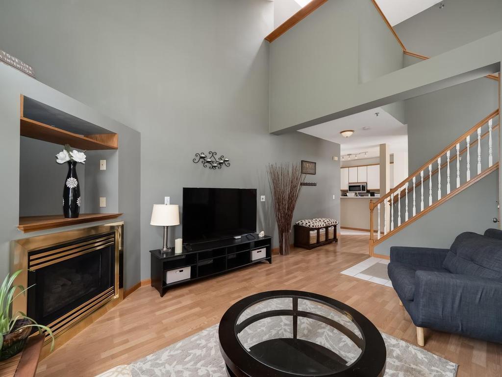 Living room with loft ceilings and gas fireplace