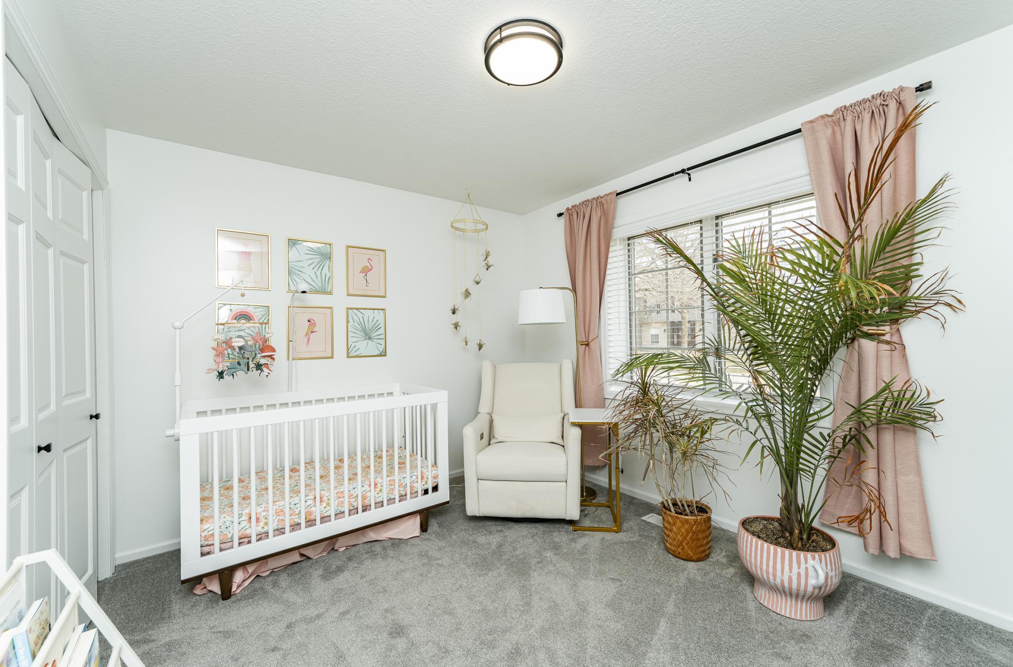 Bedroom two on main level. Lots of natural light and wood blinds.