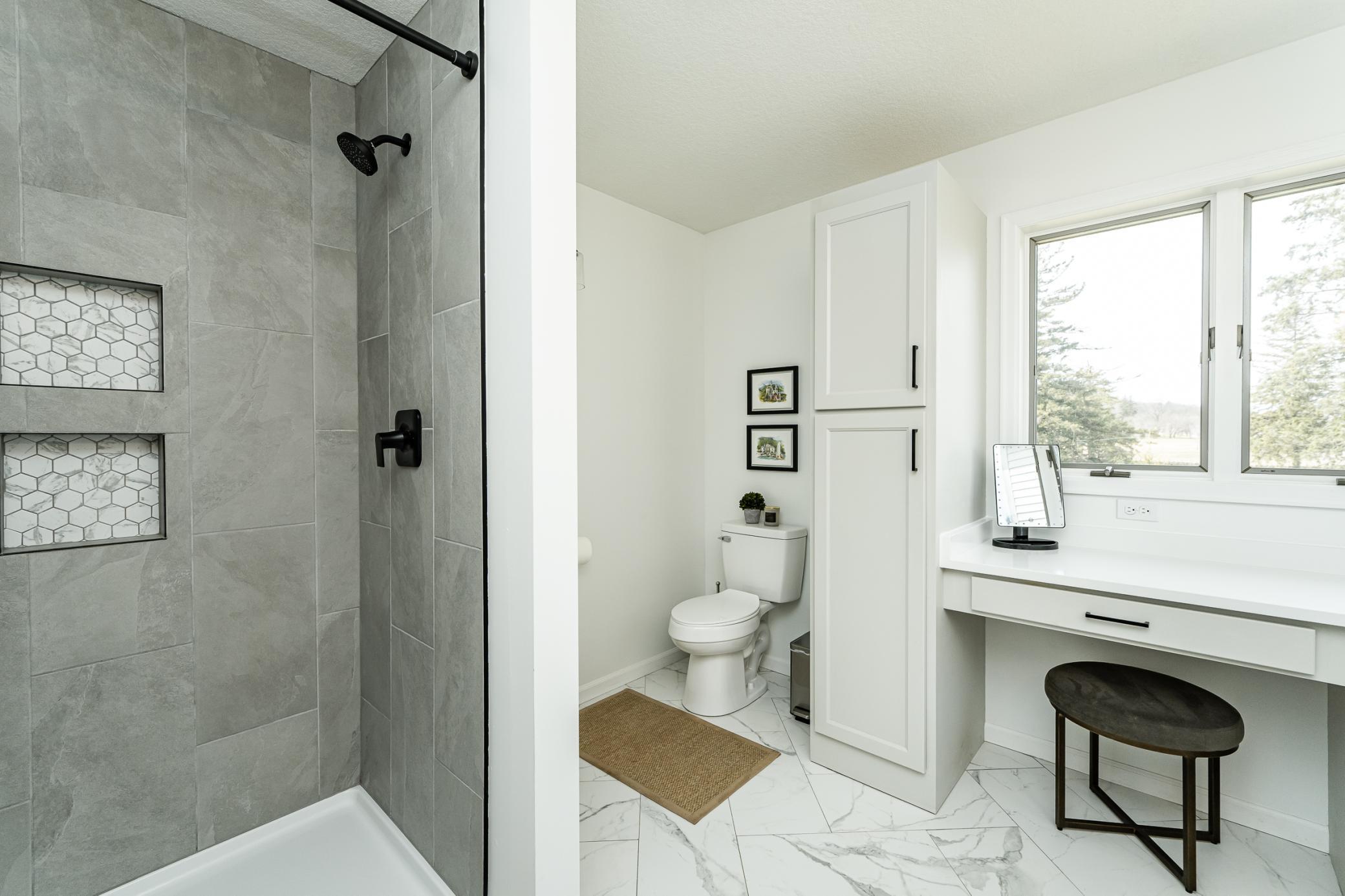 Walk in tiled shower.