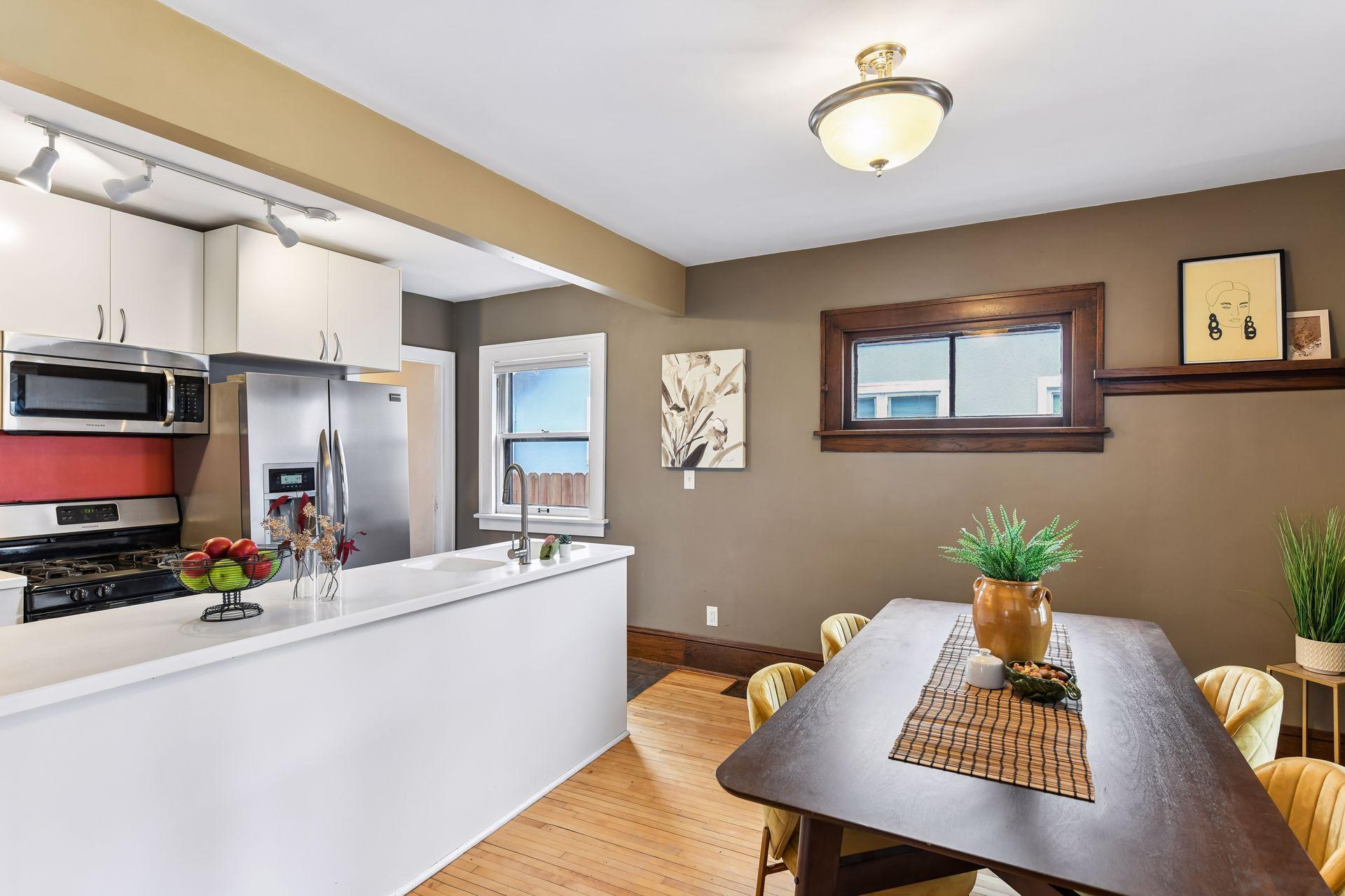 Updated kitchen opens to formal dining room.