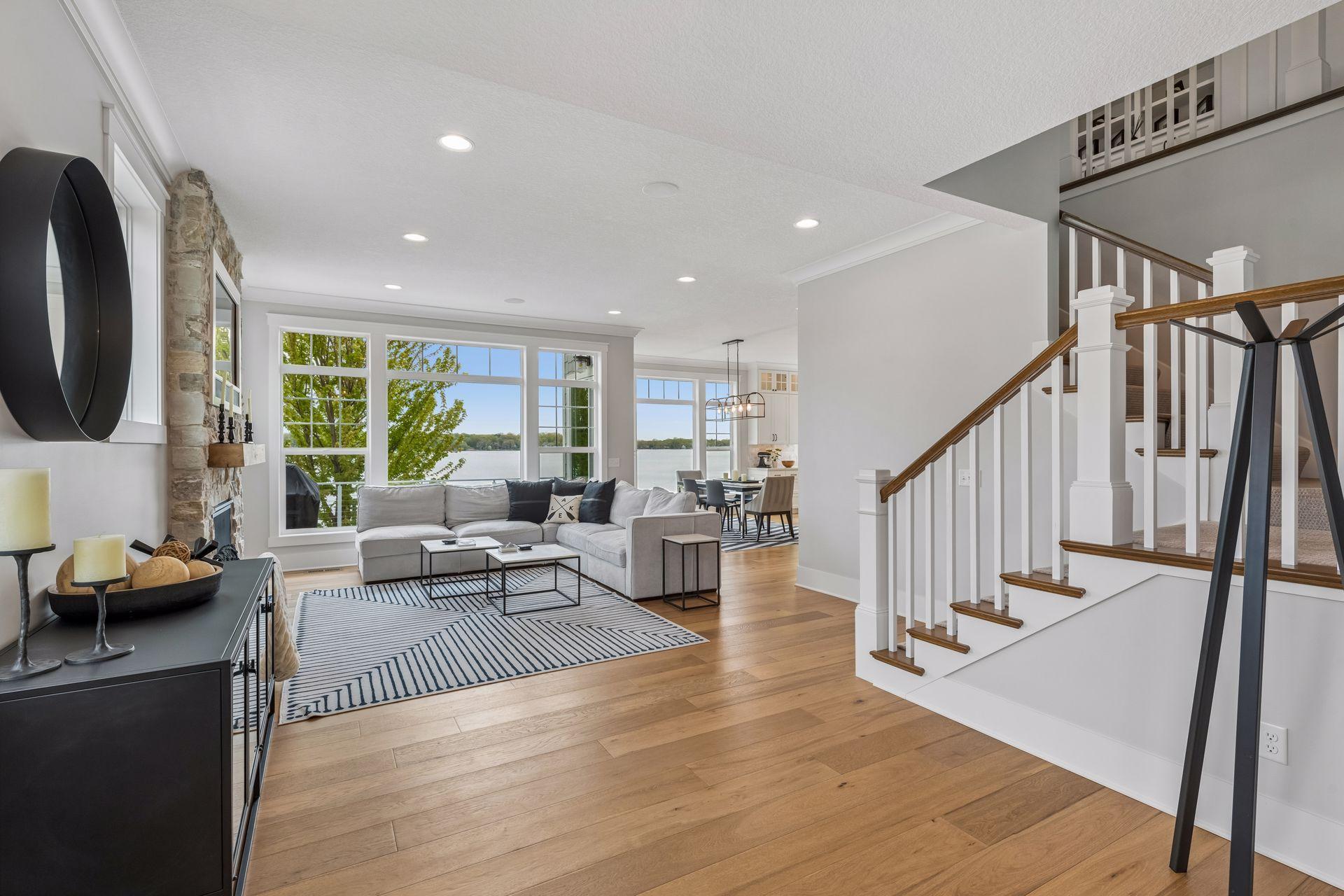 A grand welcome awaits in this custom-built retreat designed to frame panoramic water views from the moment you step inside.