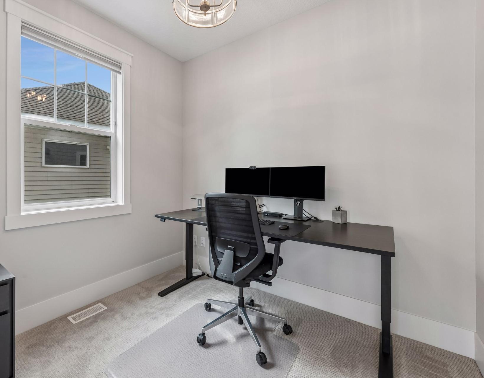 Dedicated home office on main level offers a quiet, professional environment to power your workday