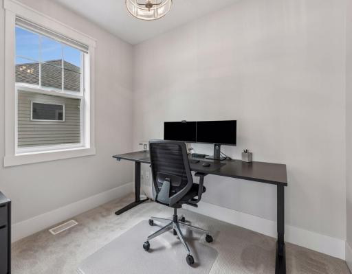 Dedicated home office on main level offers a quiet, professional environment to power your workday.
