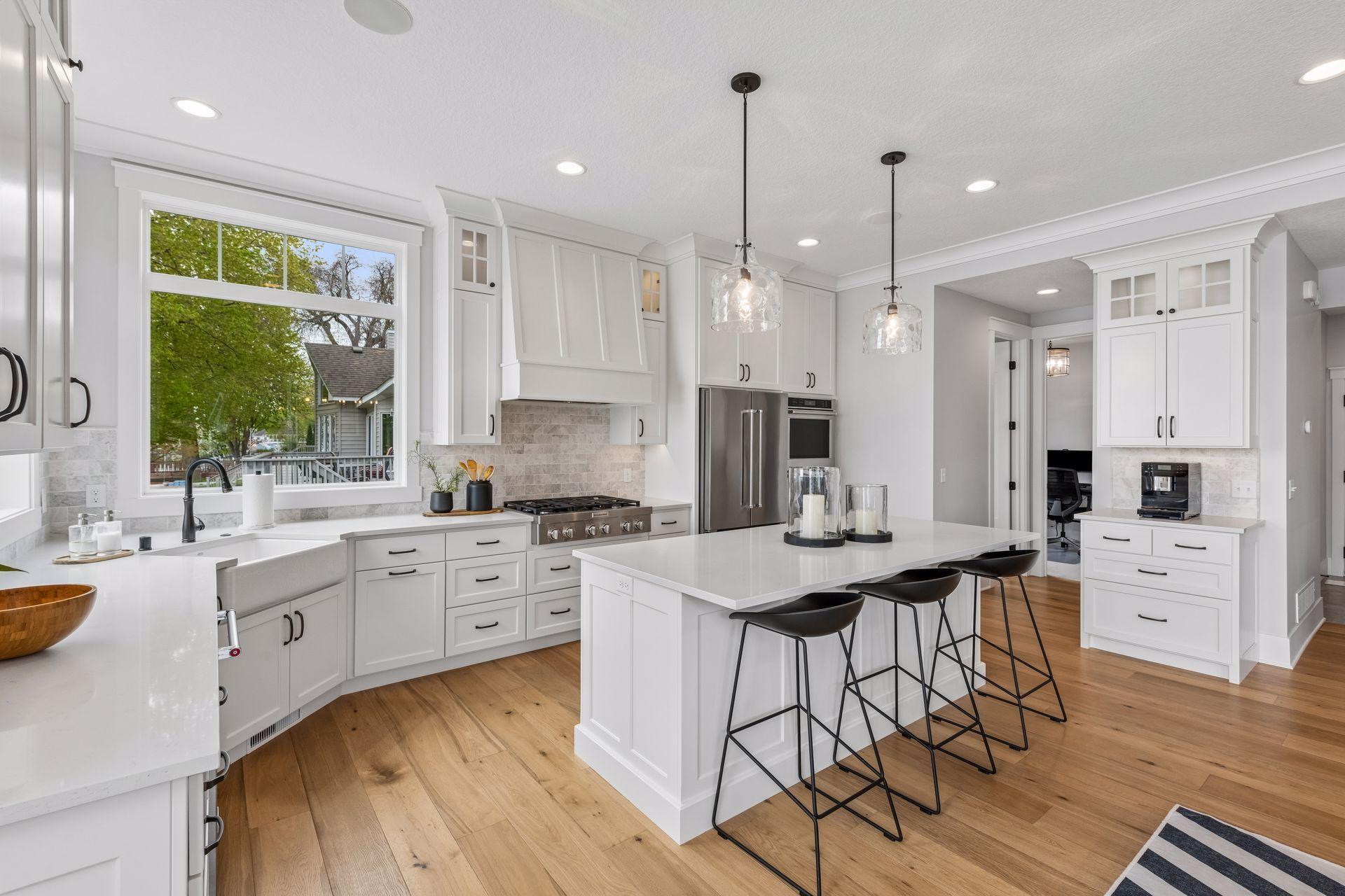 Thoughtful features include a custom vent hood, a dedicated coffee bar, and an elegant farmhouse sink
