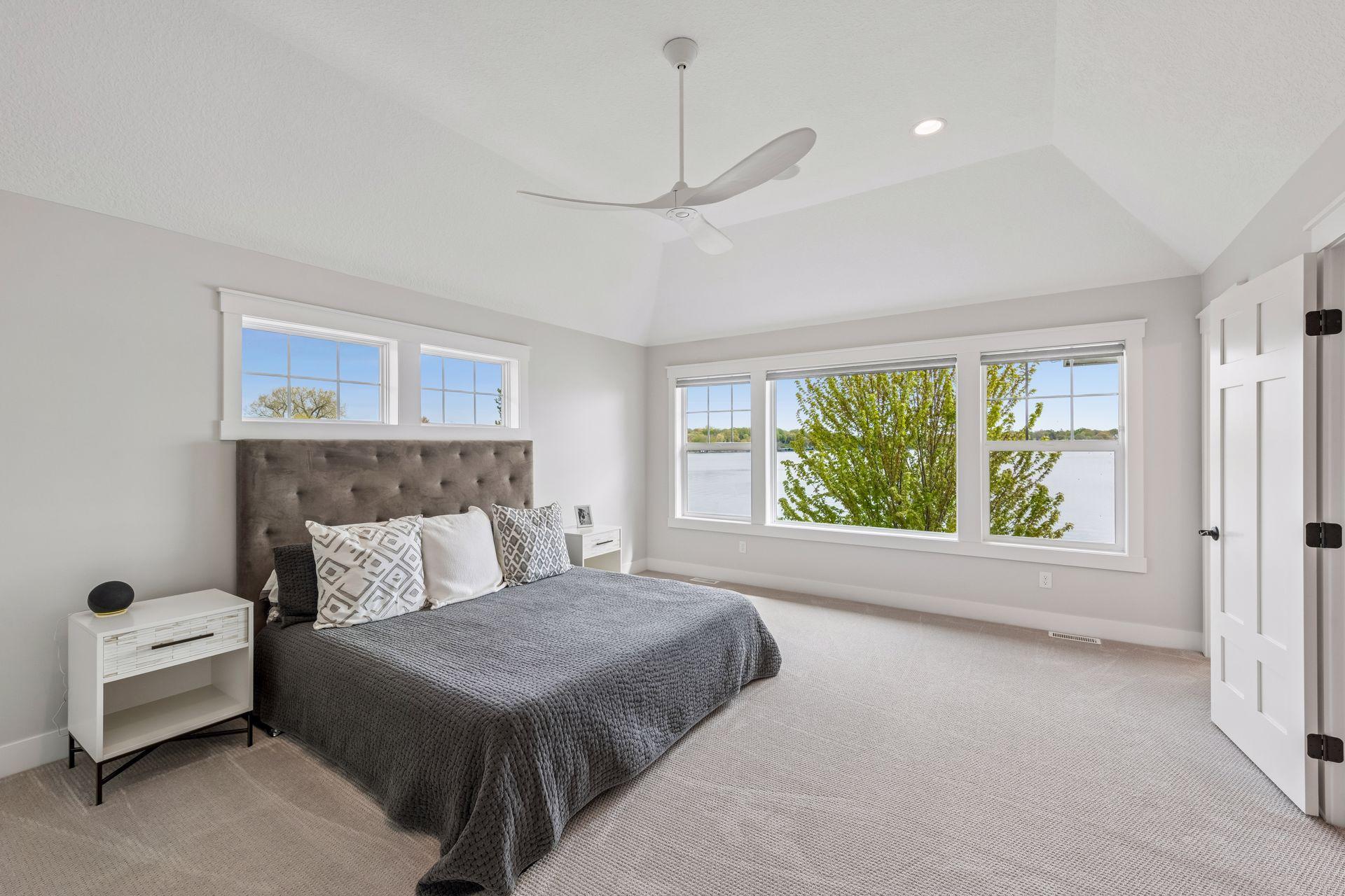 Wake up to incredible sunrises in the primary suite featuring elegant tray ceilings