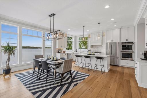 The heart of the home features a chefâs kitchen and open-concept dining area where panoramic Lake Minnetonka views serve as the ultimate backdrop for entertaining.
