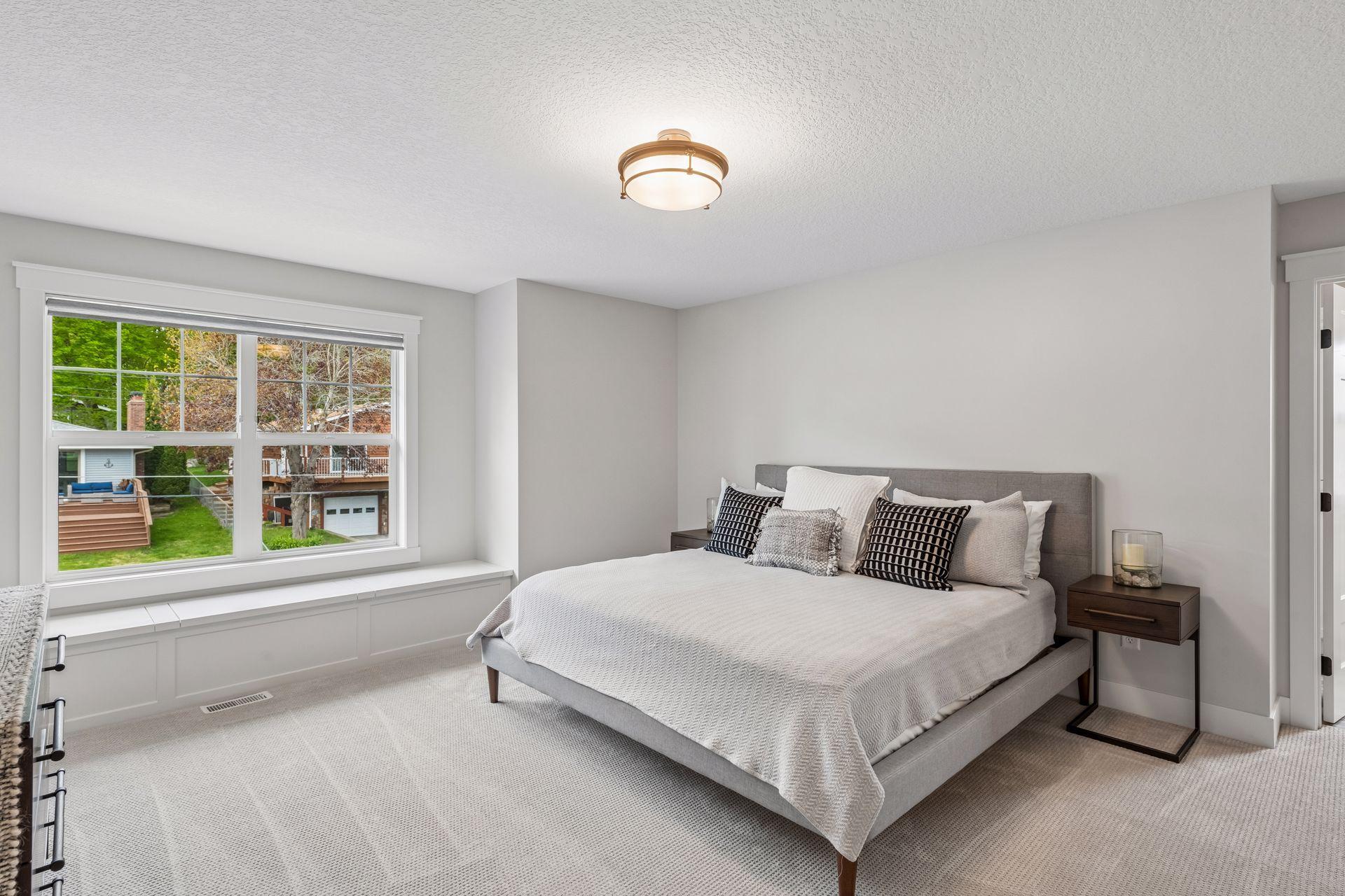 Bright second bedroom, boasting its own ensuite bath and a large walk-in closet