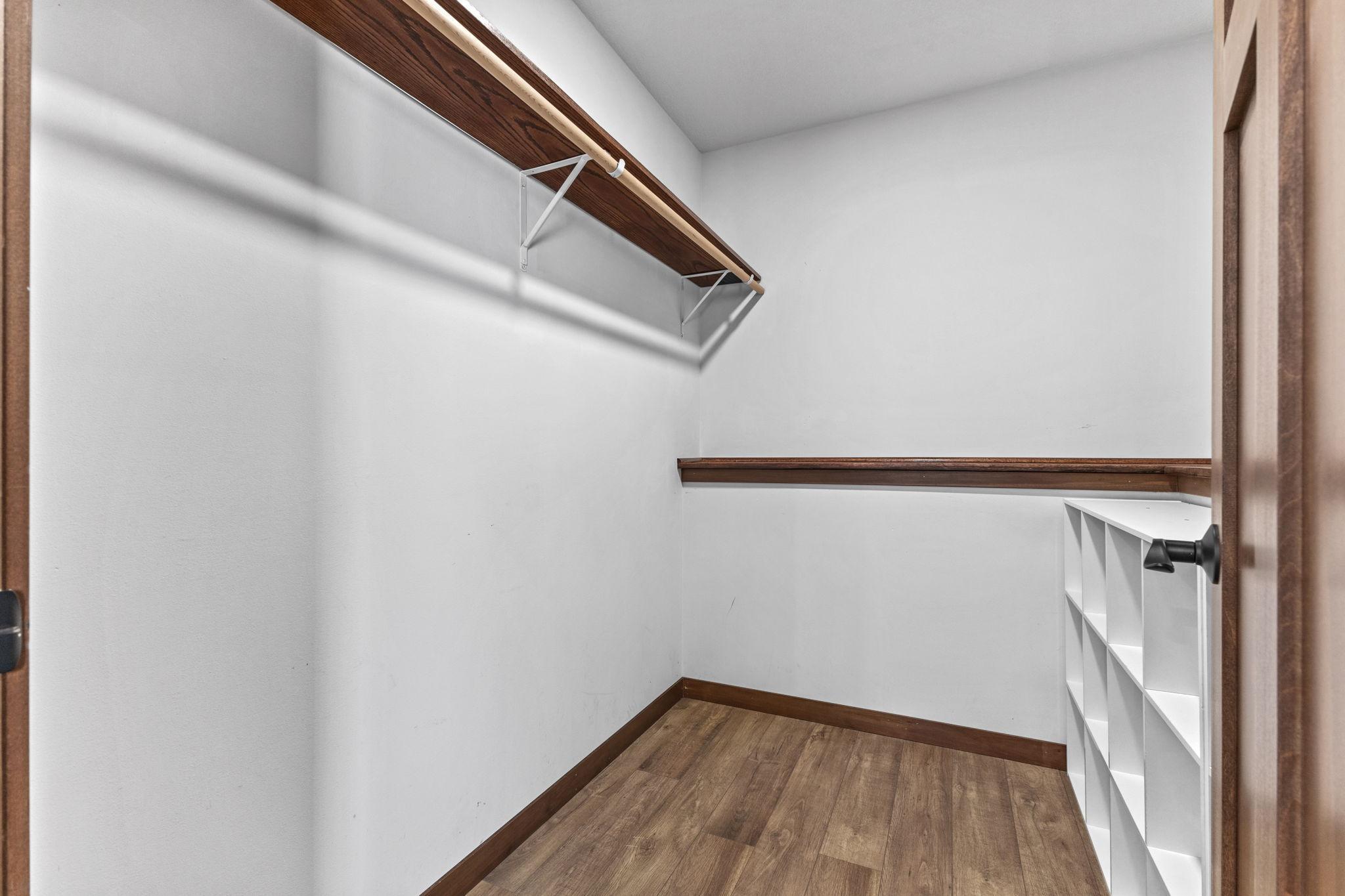 Walk in closet with shelves