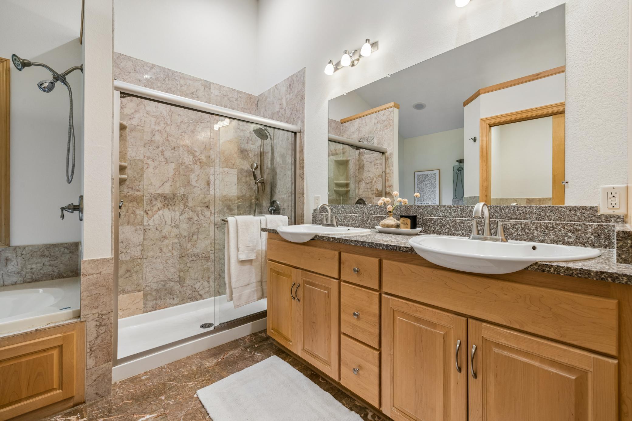 Double vanity, walk-in shower, & jacuzzi tub.