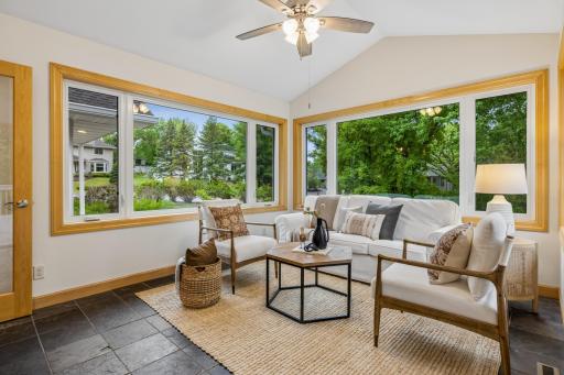 Four season porch overlooking the expansive backyard