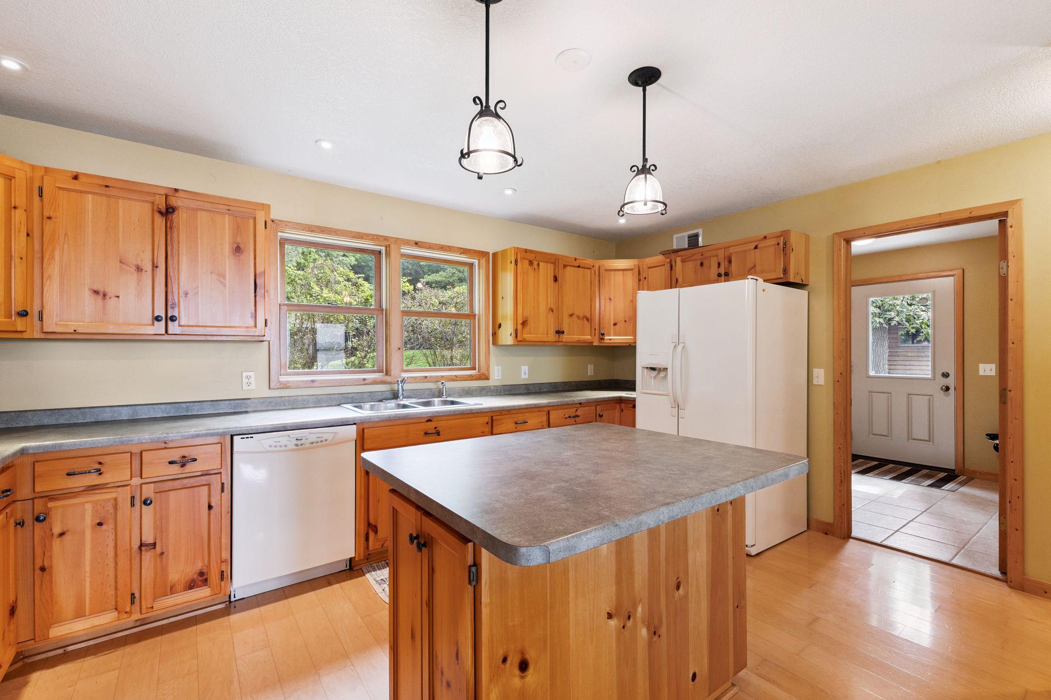 Great center island with the snack bar overhang perfect for a couple of stools