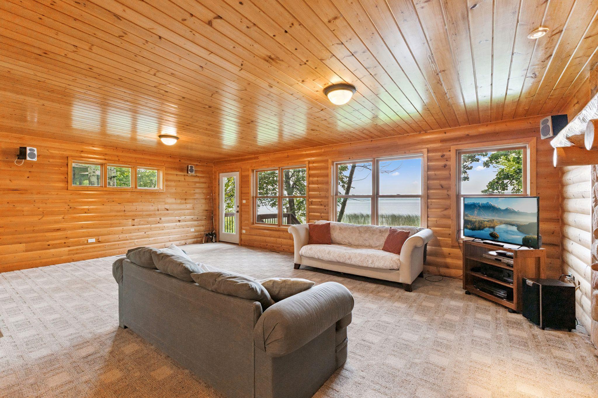 The living room walks out to the lake side deck