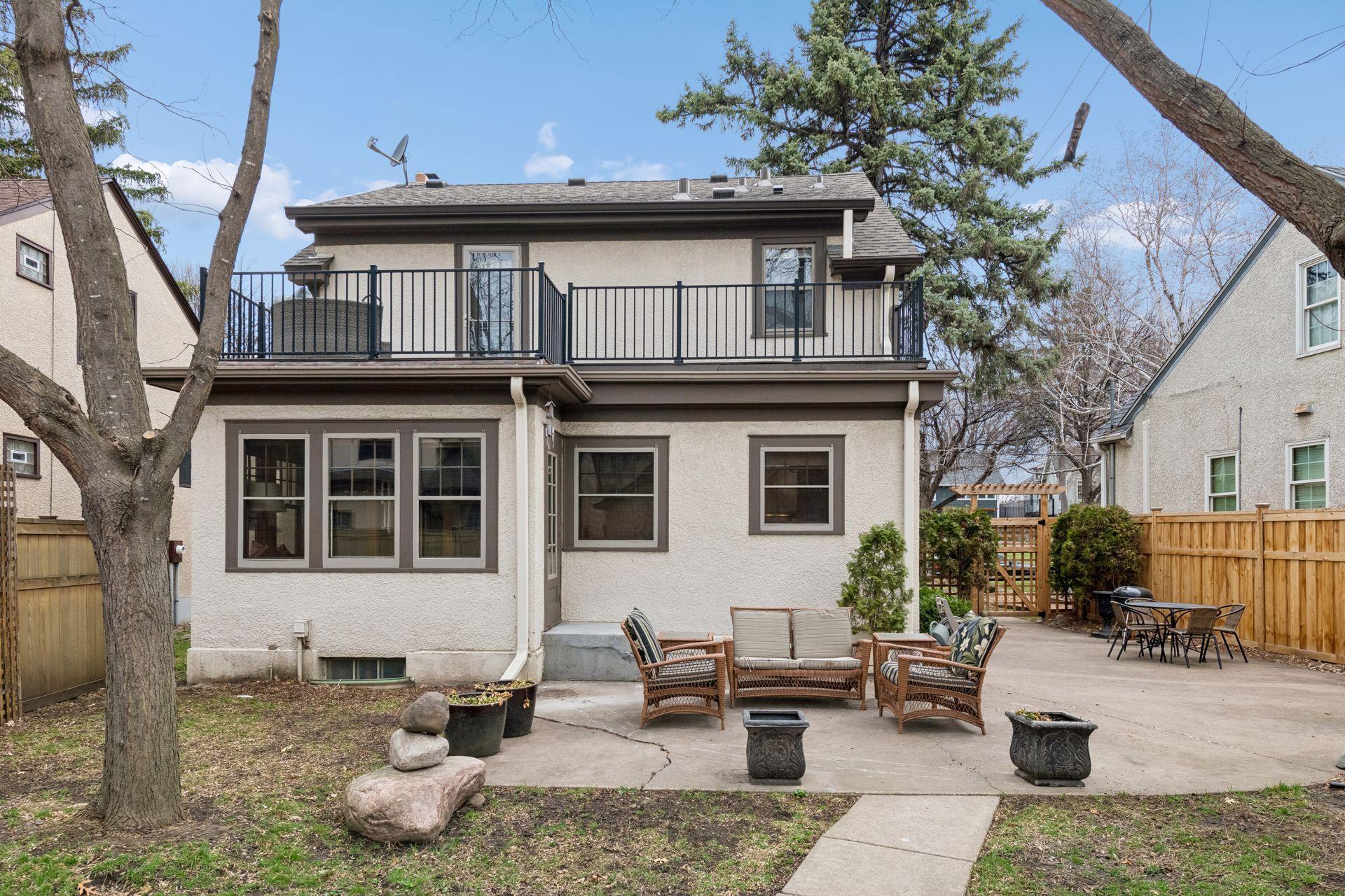 Large deck with access off the primary bedroom and large patio access from the sunroom on the main level.