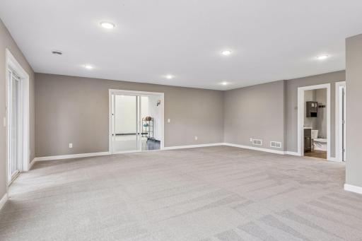 Family room opens to fantastic indoor athletic court