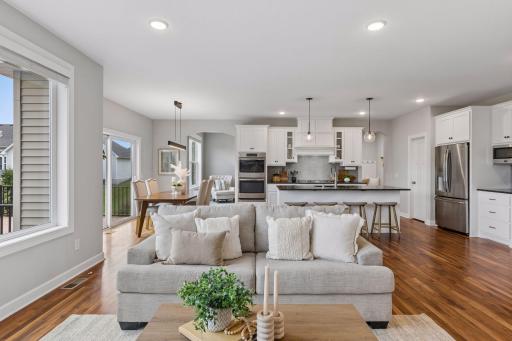 Living room opens to dining room and center island kitchen