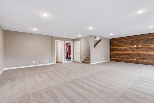Lower level family room opens to three quarter bath and fifth bedroom