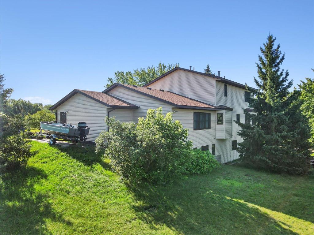 Spacious multi-level home tucked into a scenic setting with nature views, mature landscaping, and abundant outdoor space.