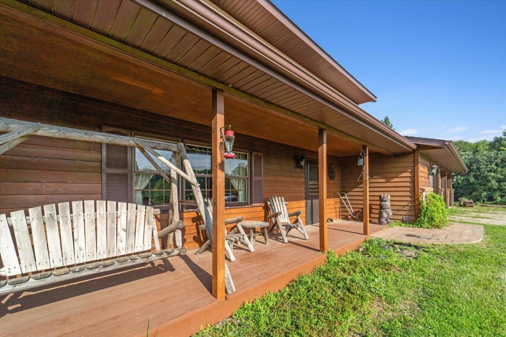 Relax and enjoy the peaceful setting from the covered front porch overlooking the beautiful surrounding landscape.