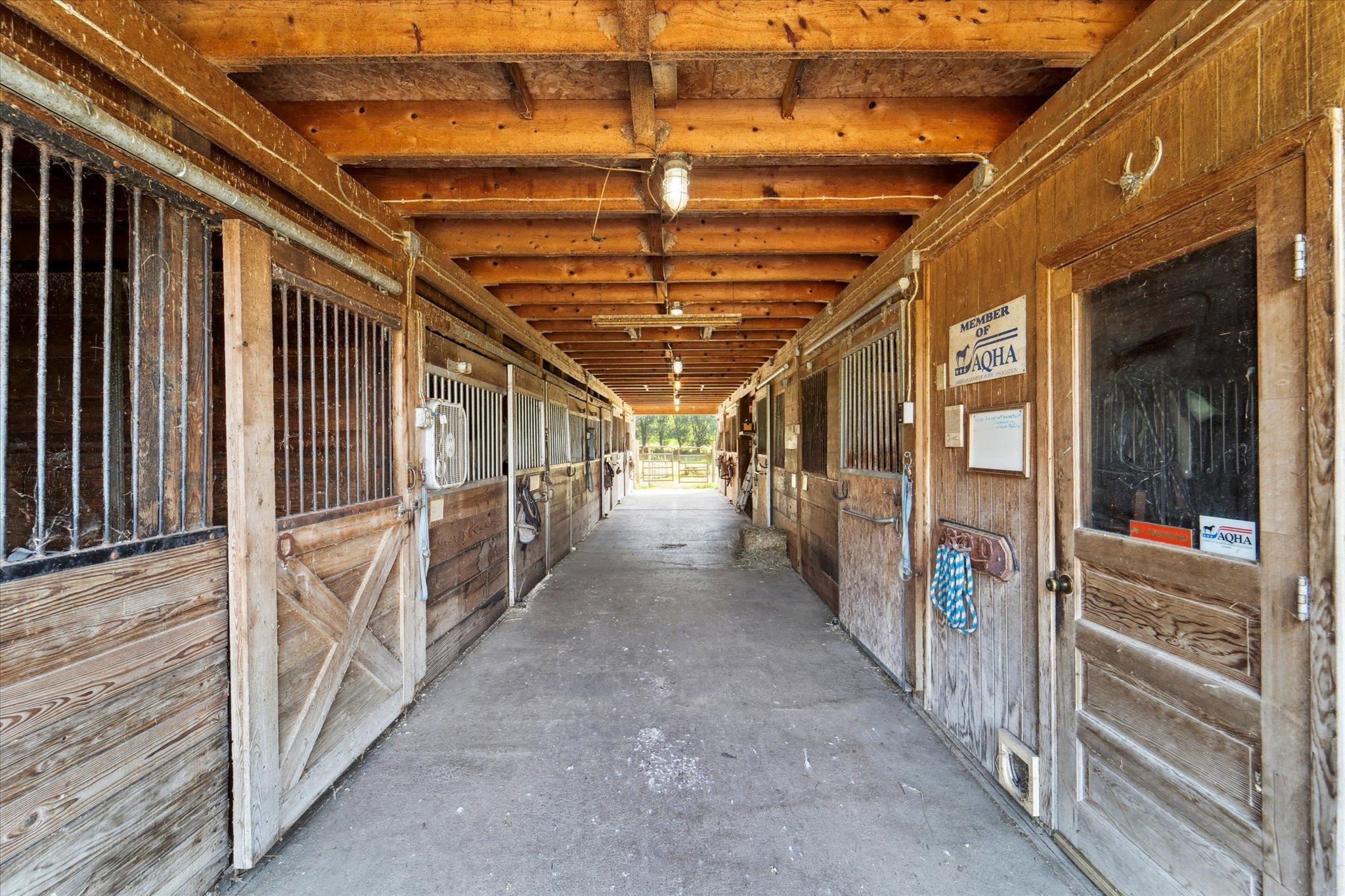 Incredible horse-ready barn featuring multiple stalls, durable construction, and excellent setup for hobby farm or equestrian use.
