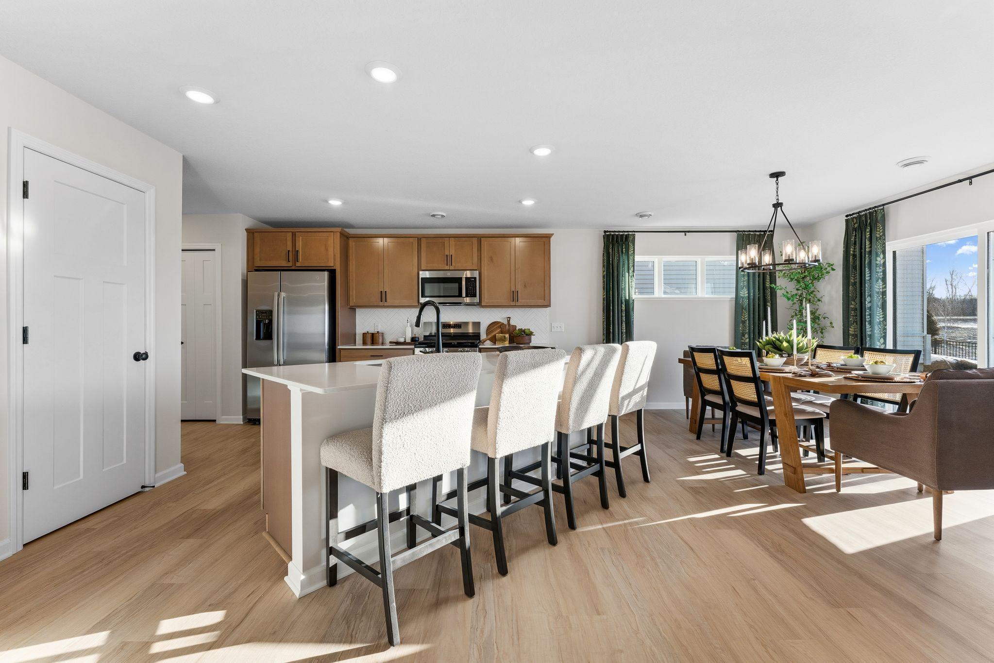 Entertain guests at your new kitchen island in this open concept layout! Photo for reference only. Style, color and collections will vary.