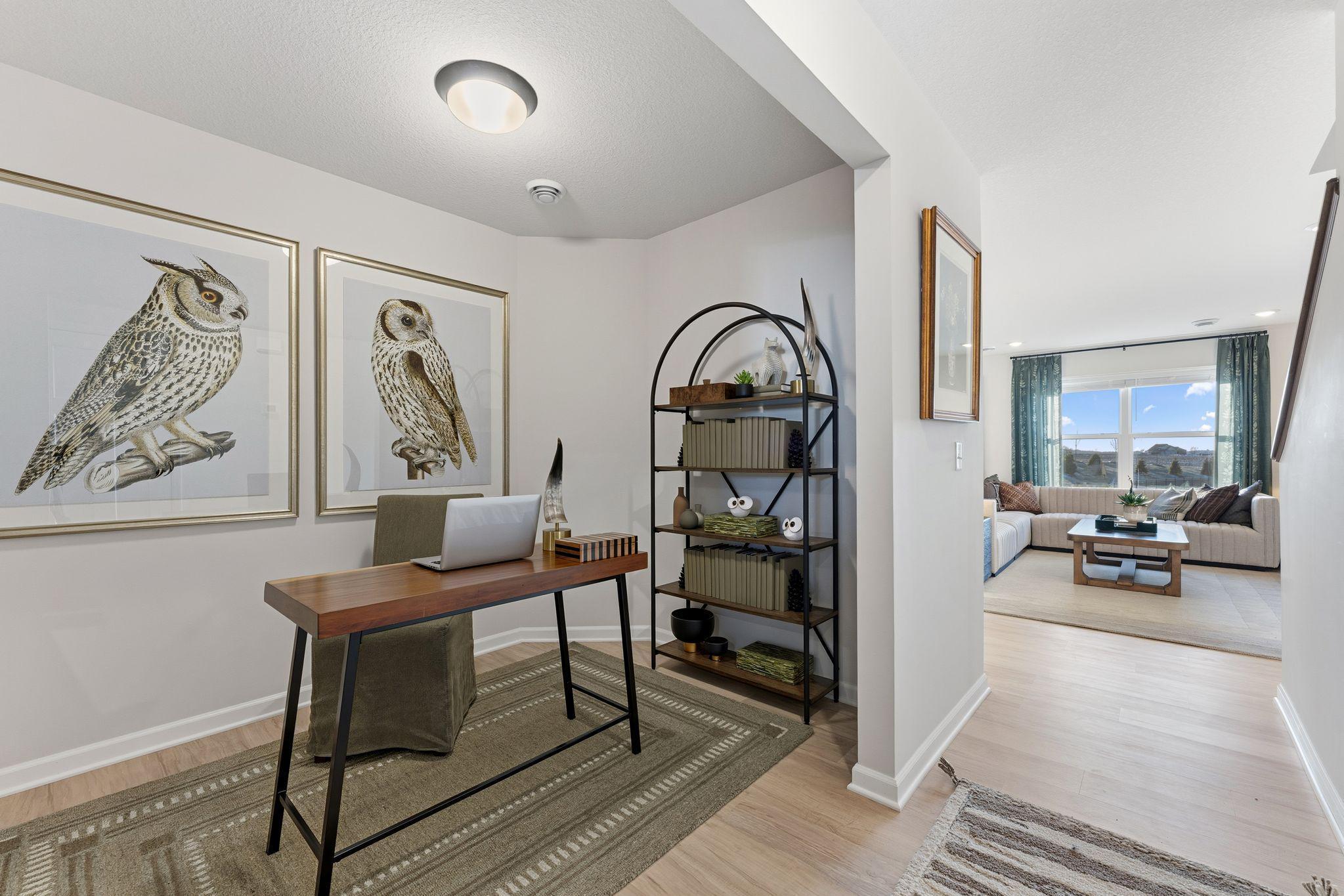 Versatile main floor flex room, perfect for home office! Photo for reference only. Style and colors may vary in actual home.