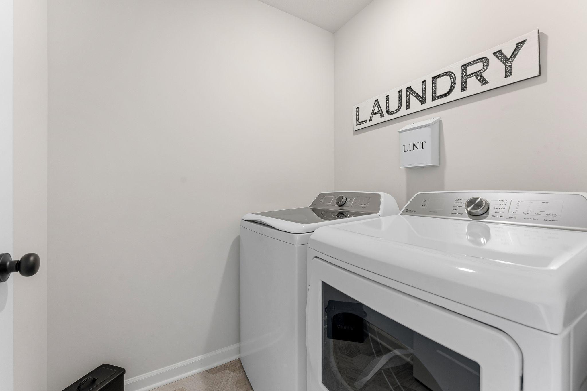 Who wants to walk all the way downstairs to do the laundry?! Not you! And you won't have to w/this upper level laundry room! Washer & dryer included! Photo for reference only. Style, color and collections will vary.