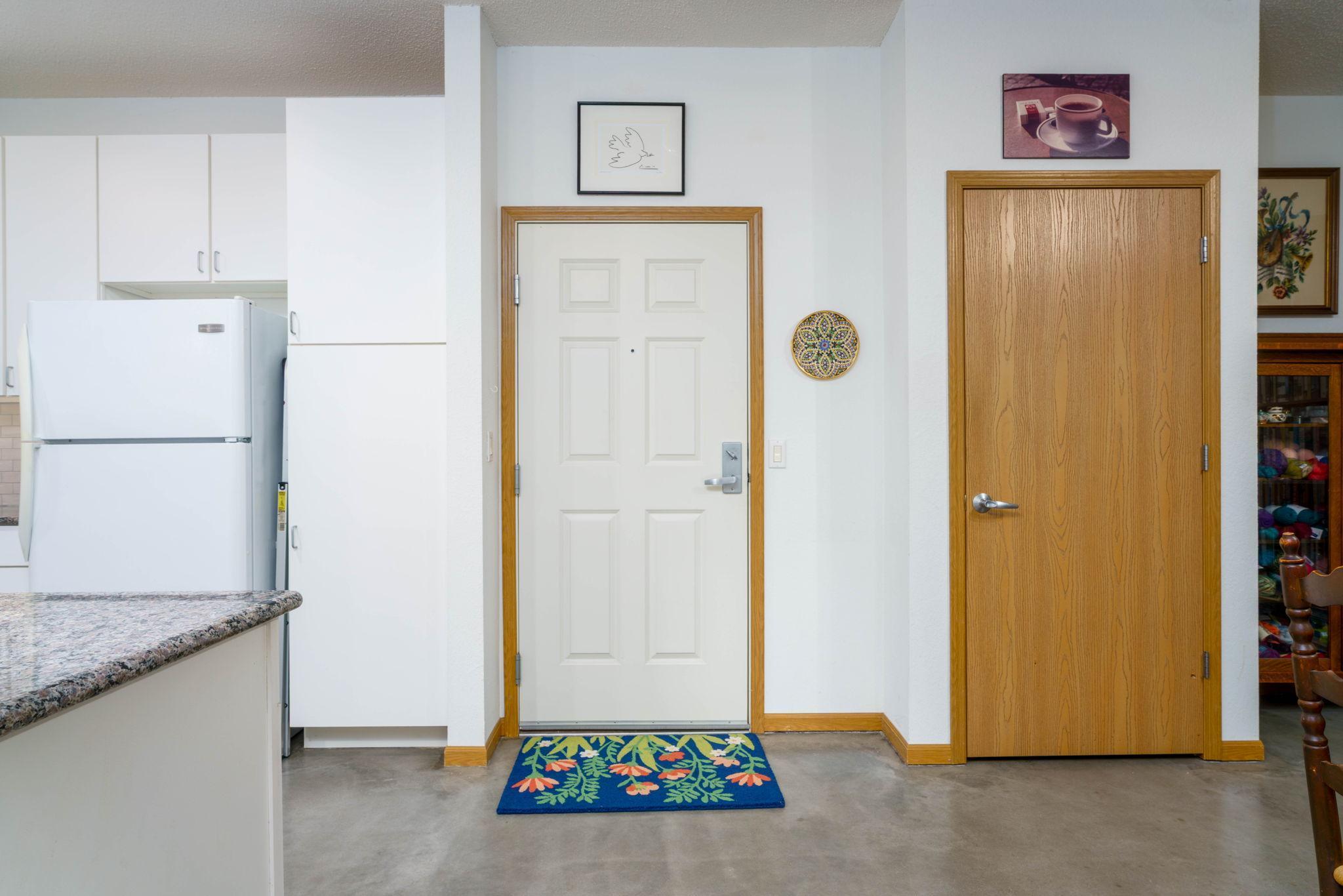 Entrance into unit - note the contemporary concrete flooring throughout. Right outside of your entrance is your private storage locker- note, that not all units have a storage locker- another plus of this unit.