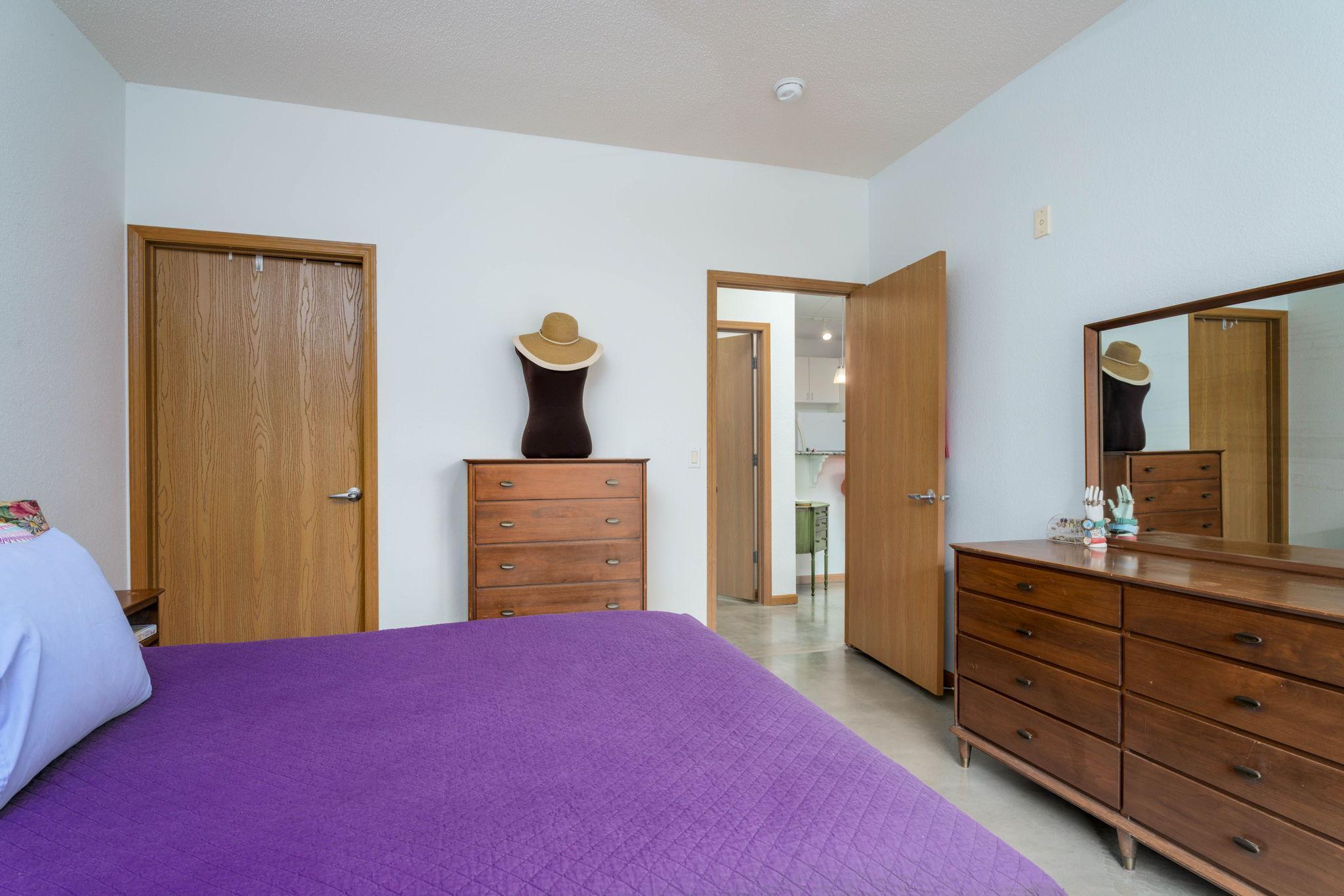 Primary bedroom leading to hall. Note the good size of the bedroom.