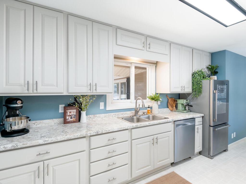 Plenty of prep and storage space is available in the kitchen with updated shaker-style cabinetry.
