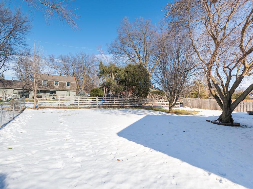 Large backyard with fencing and plenty of space for recreation.