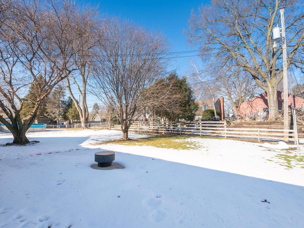Spacious backyard with mature trees and room to enjoy the outdoors.