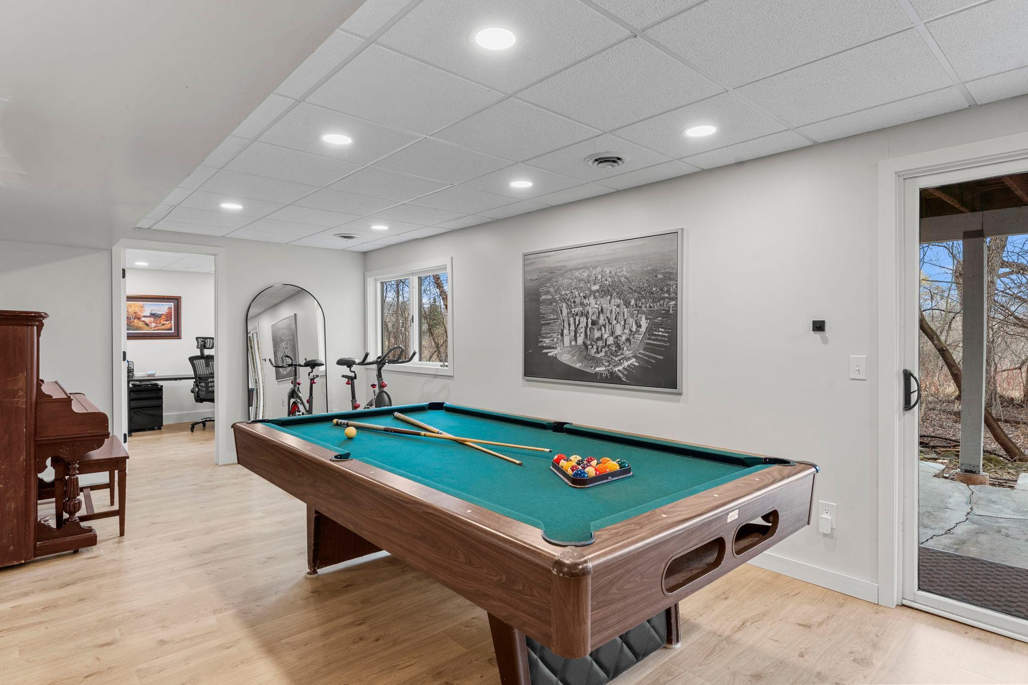 Another view of the recreation space, showcasing the entrance to bedroom five.