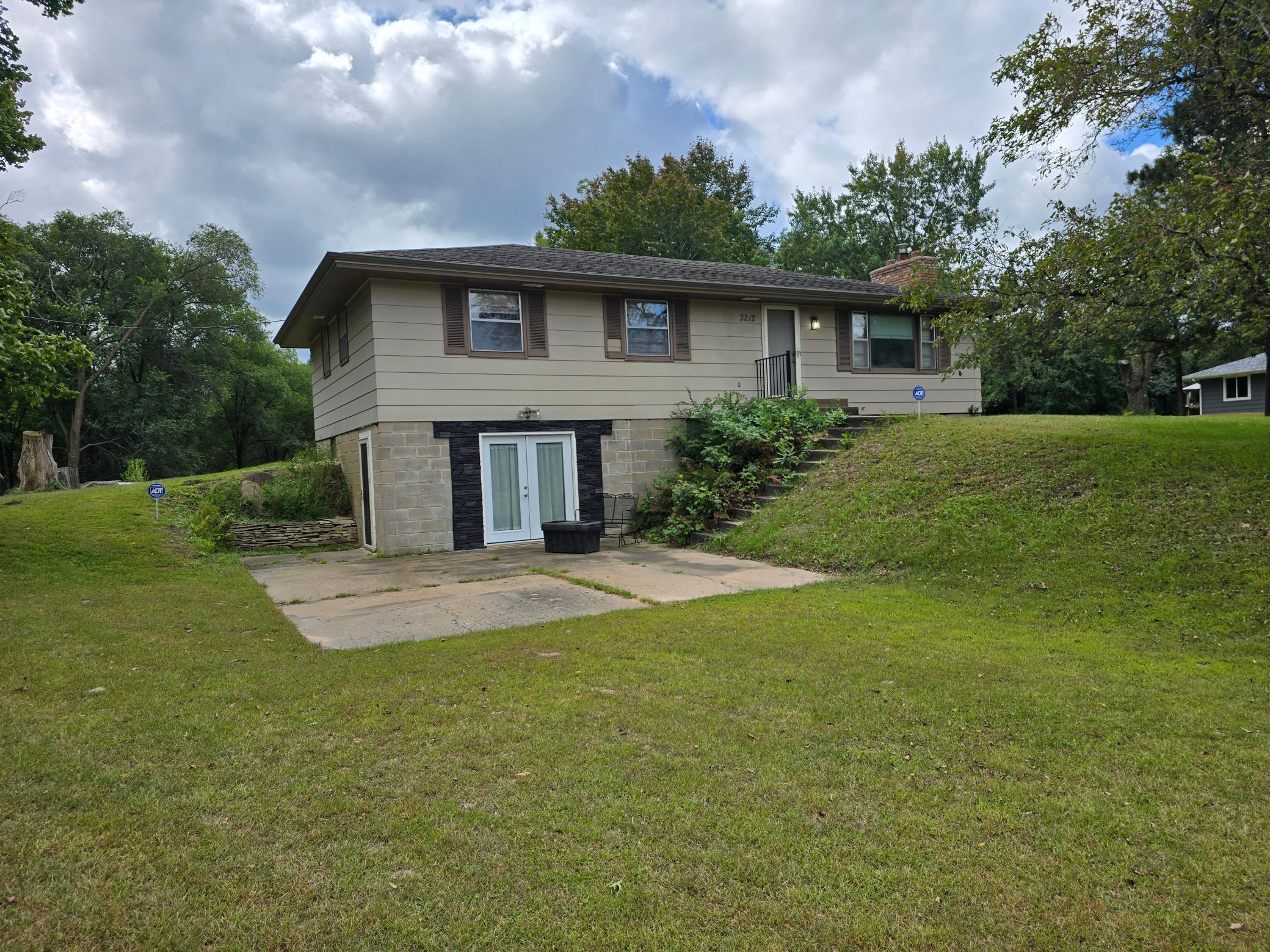 Walk out to the patio from the lower level of the house.