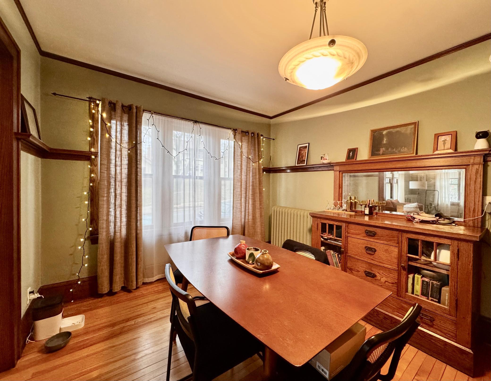 Each unit has original wood work, custom built-in shelves, picture frame molding, hardwood floors, and an oak built-in buffet.