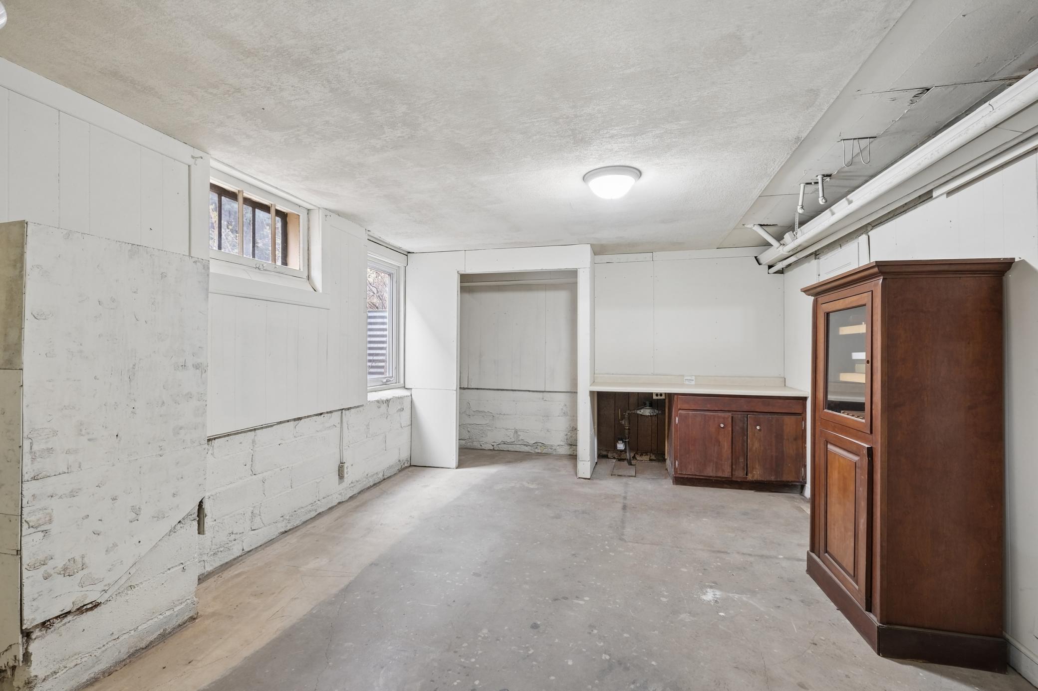 Lower level has an egress window and lots of potential for a gym, studio, office, storage, or check with the City for the possibility to build out a 5th unit.