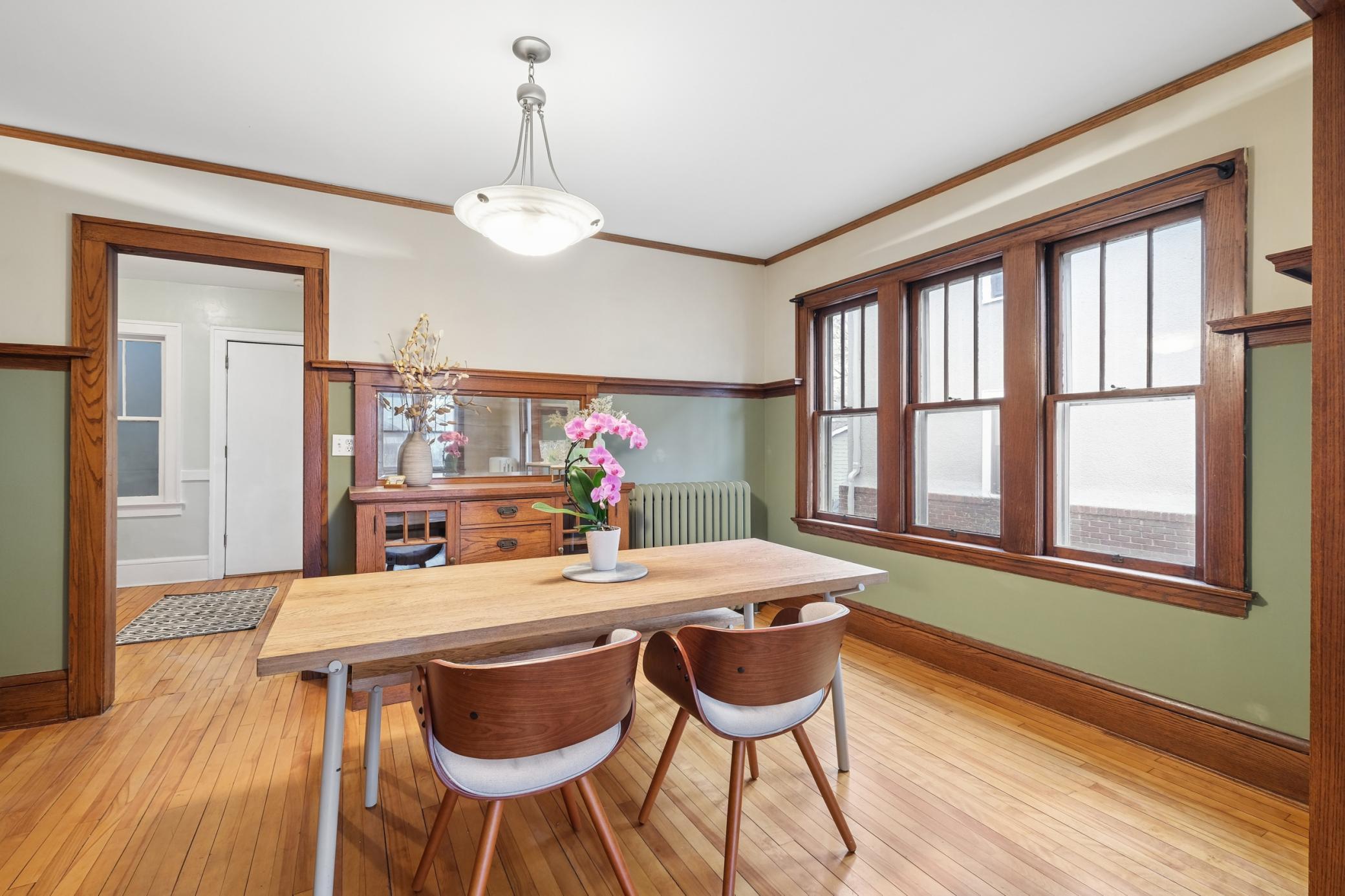 Unit 2 dinning room. All units have a built-in buffet, custom decorative shelf, and picture frame molding for hanging art.