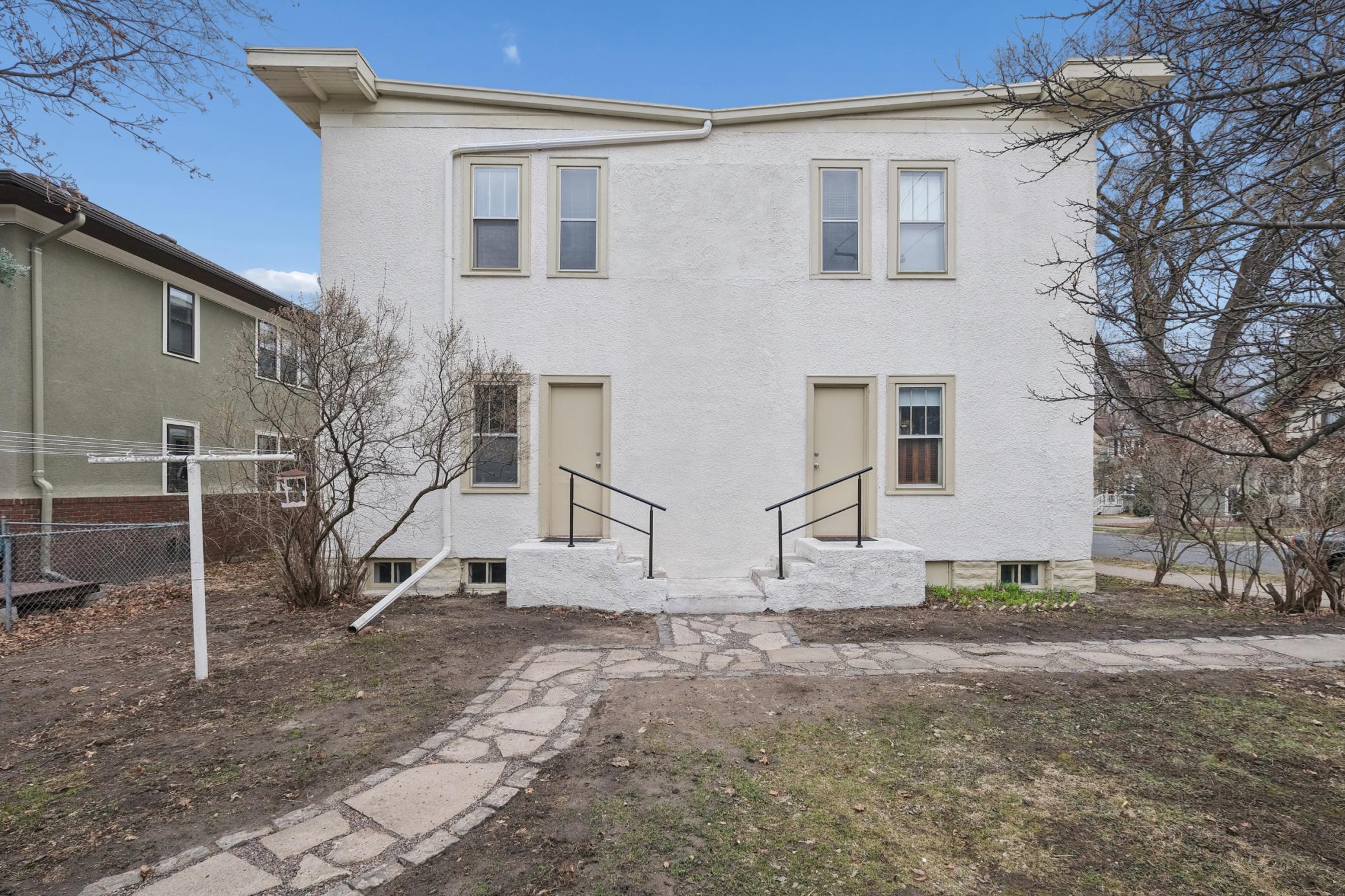 View of the yard and the back of the 4-plex.