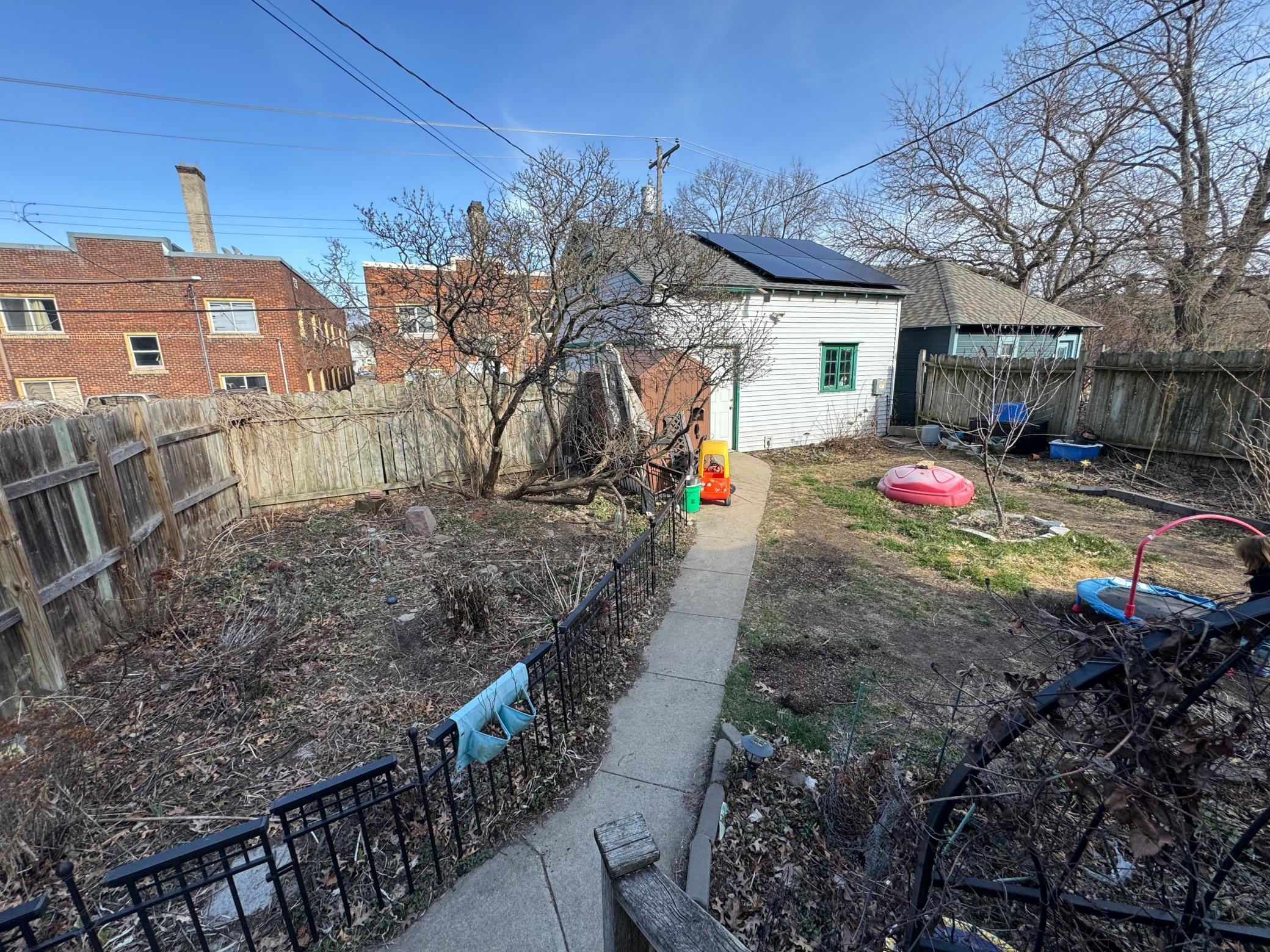 Spacious completely fenced back yard for kids, dogs and gardening!