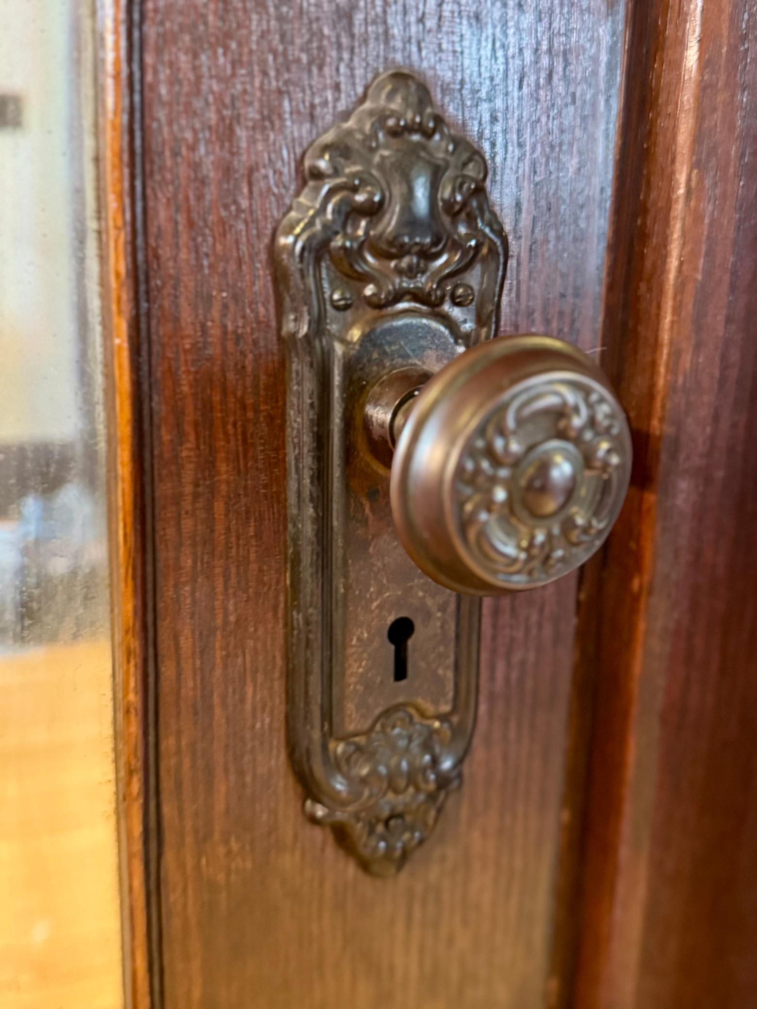 Original brass knob and plate detail