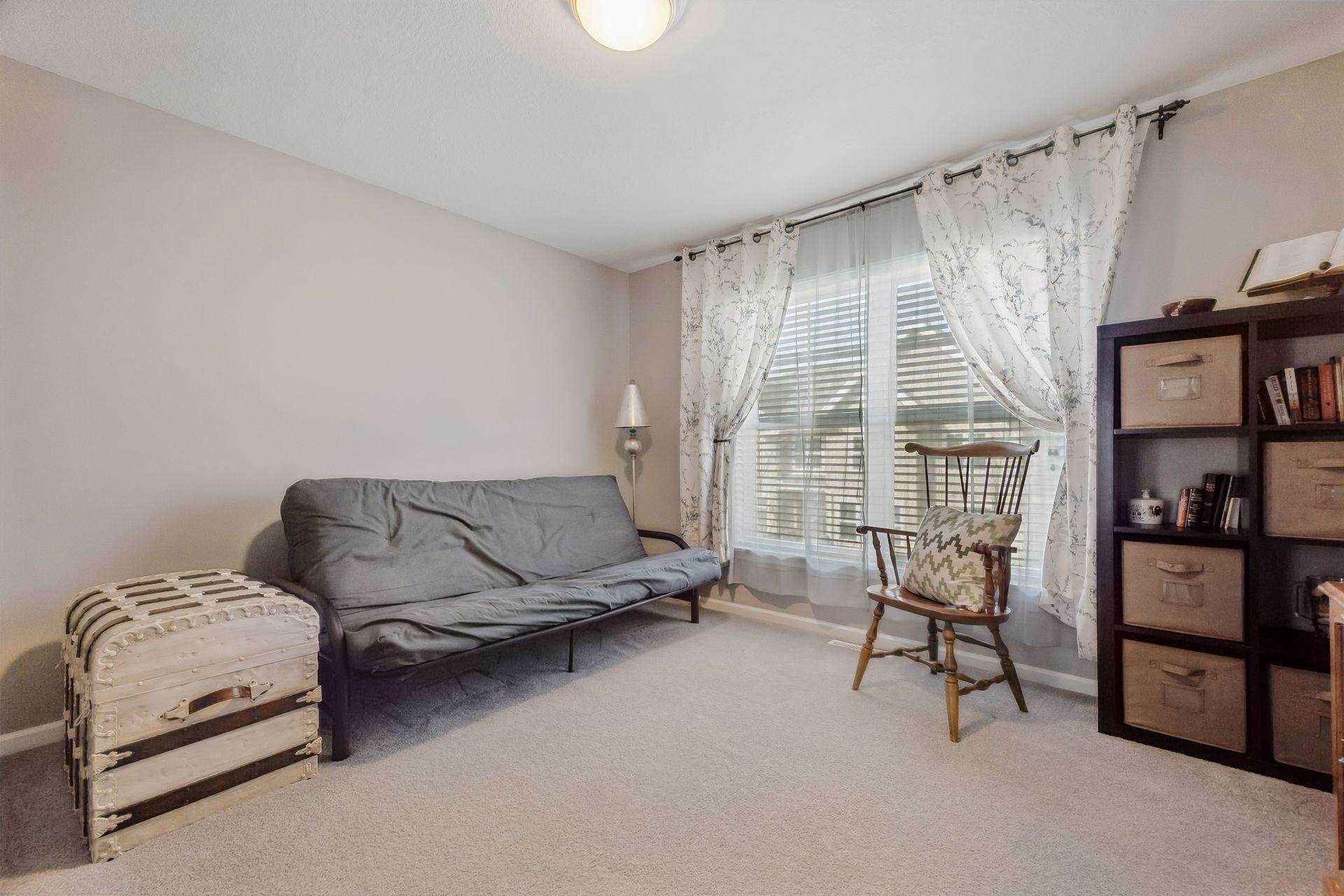 Second bedroom with large windows